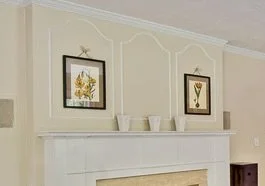 Wall trim over fireplace mantle