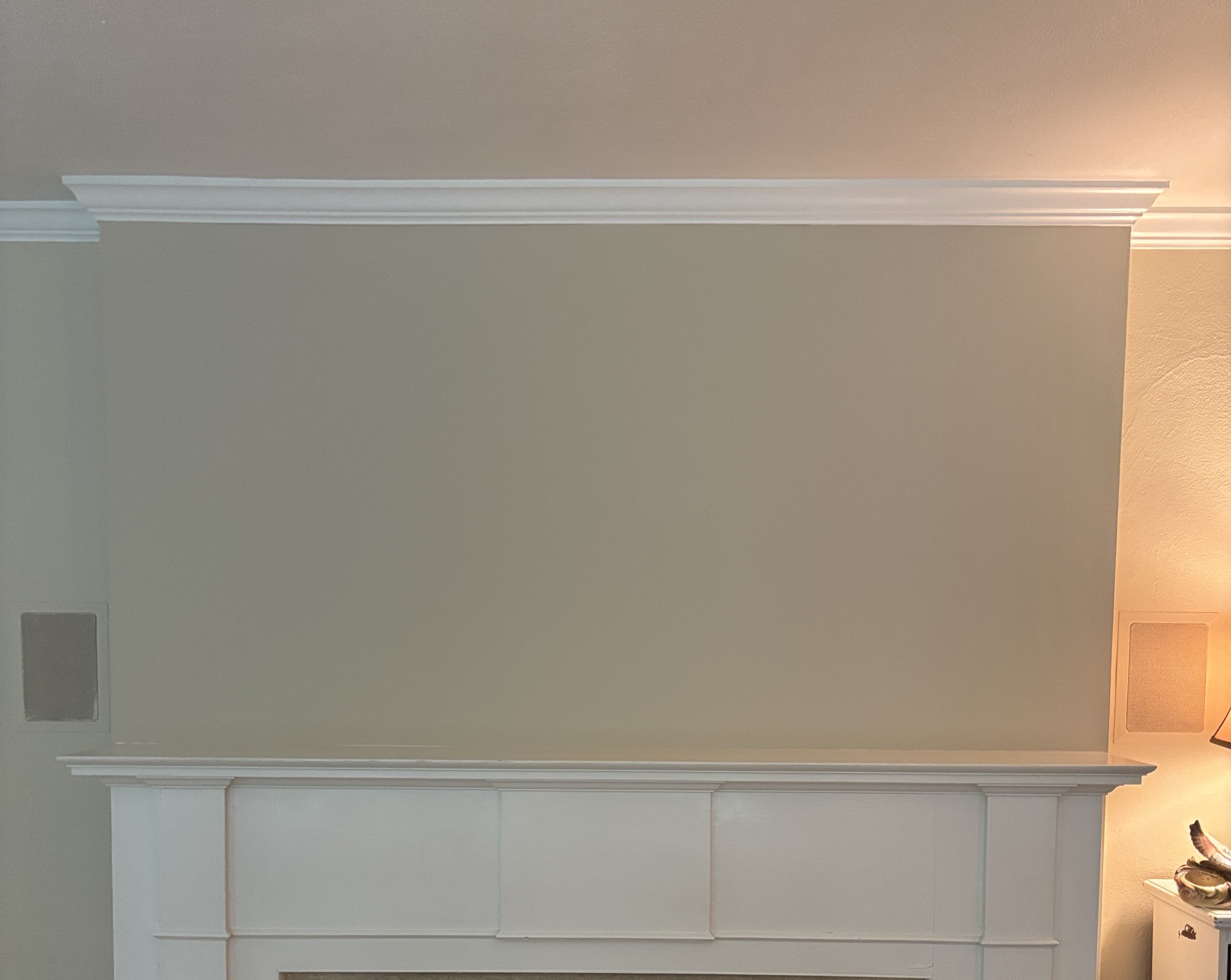 Smooth, large, neutral fireplace wall