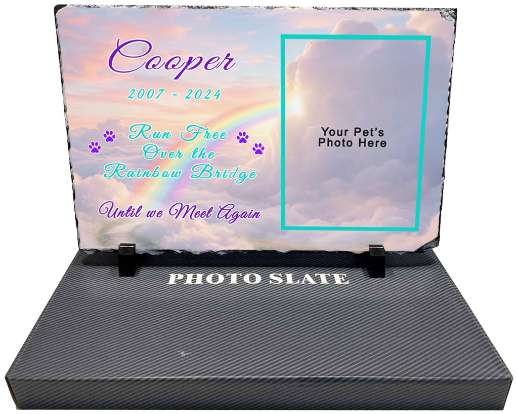 A memorial photo slate with a cloud and rainbow background. The slate has  space for a pet's name, dates, photo and a sentimental message about the pet's lasting memory.