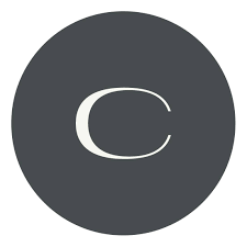 Gray circular sign with a white letter C in the center