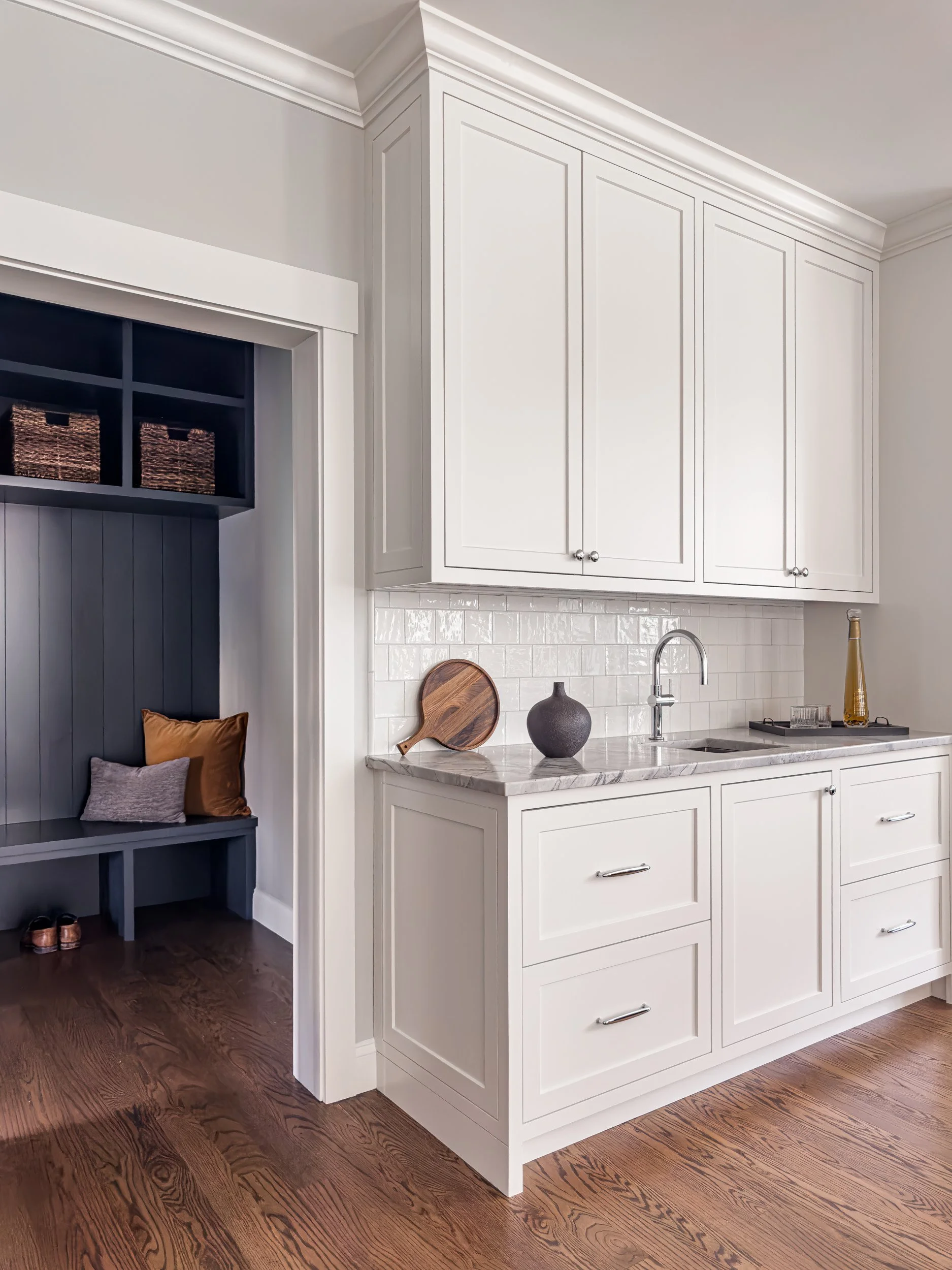 Best general contractor, home builder, and home remodeler on the Northshore in Andover, Massachusetts (MA), developed this modern high spacious kitchen with white cabinets, a large central island, pendant lighting, and an energy efficient window.