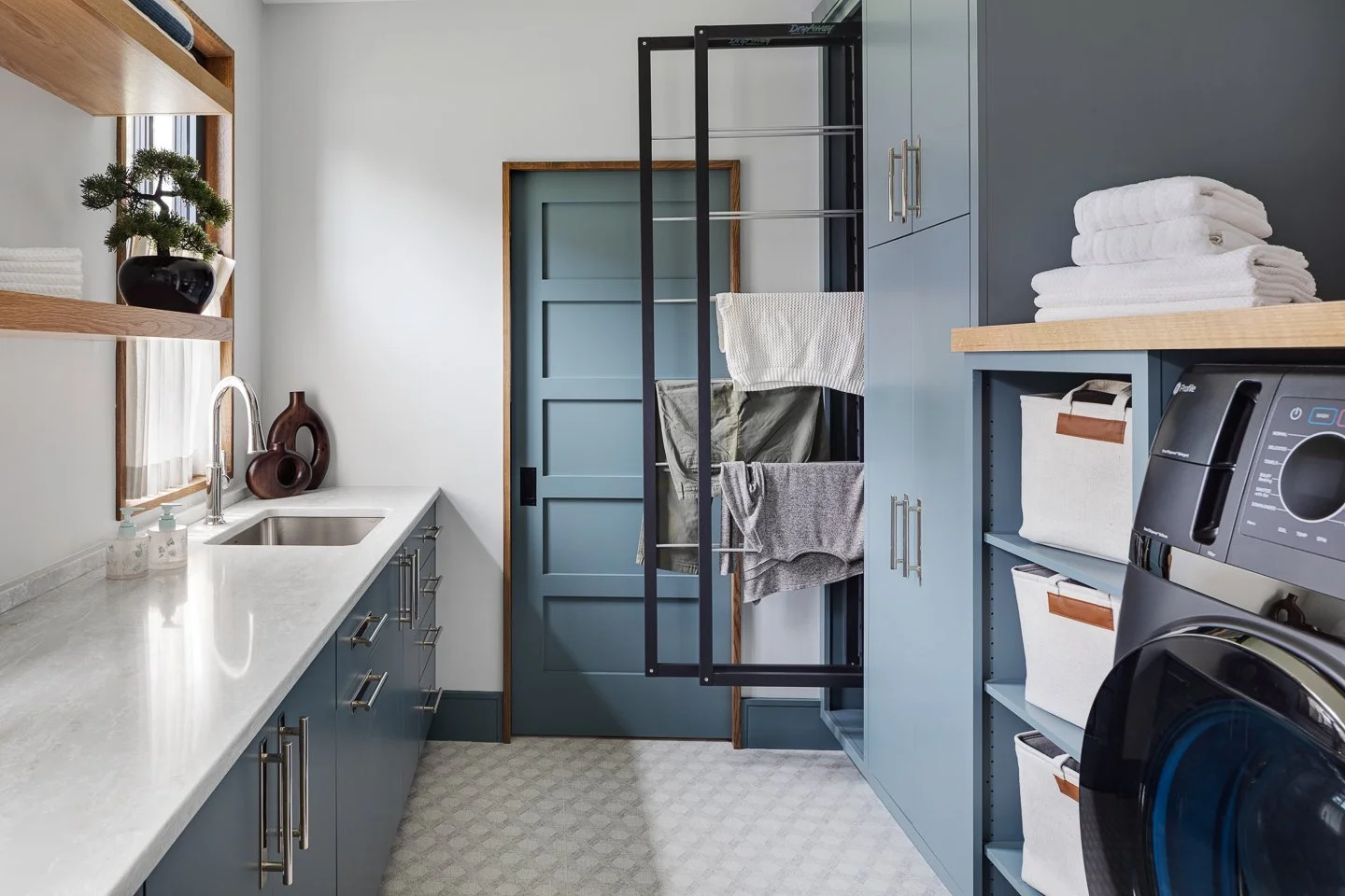 Best general contractor, home builder, and home remodeler on the Northshore in Andover, Massachusetts (MA), developed this modern laundry room.