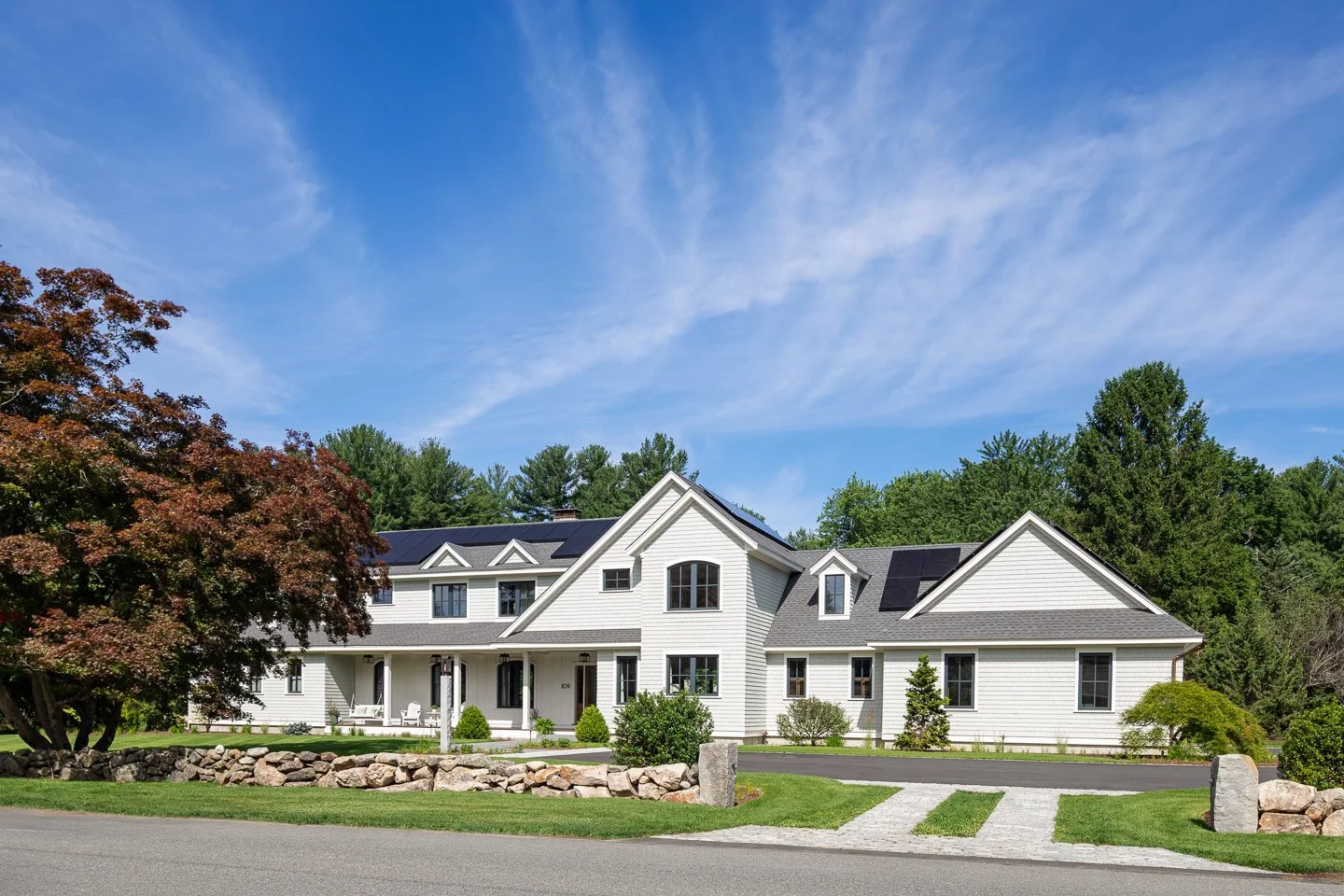 Best general contractor, home builder, and home remodeler on the Northshore in Andover, Massachusetts (MA), developed this large energy efficient farmhouse with Tesla batteries and solar panels.