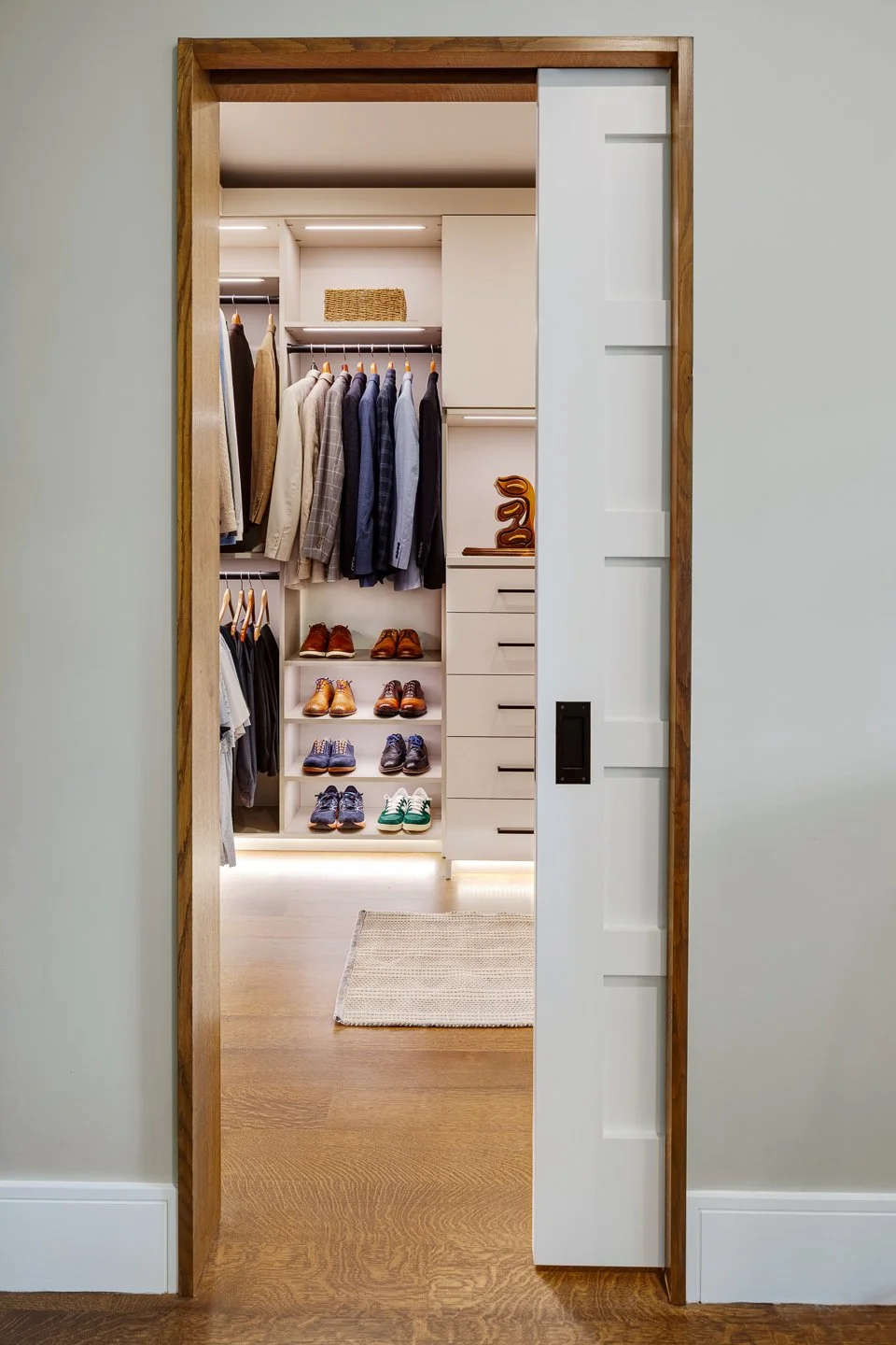 Best general contractor, home builder, and home remodeler on the Northshore in Andover, Massachusetts (MA), developed this modern primary closet.