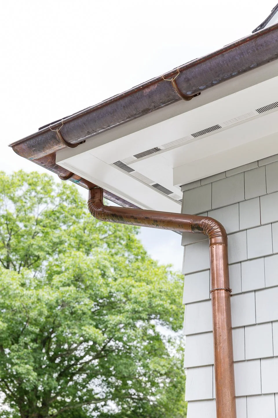 Best general contractor, home builder, and home remodeler on the Northshore in Andover, Massachusetts (MA), developed this modern house with a copper gutter and downspout.