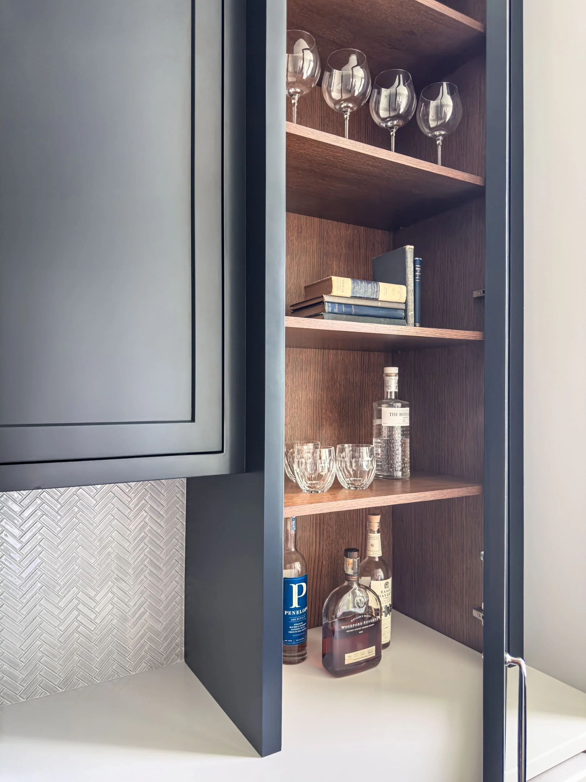 Best general contractor, home builder, and home remodeler on the Northshore in Andover, Massachusetts (MA), developed this modern high spacious kitchen with white hidden appliance storage and coffee station 
