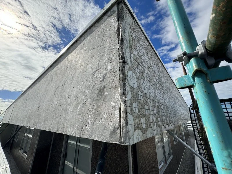 Removal of old tiling on Facade