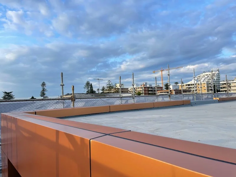View of corner of rooftop where new cladding has been installed