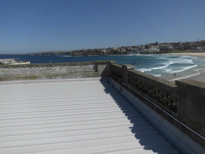 Old rooftop with weather-damaged masonry wall
