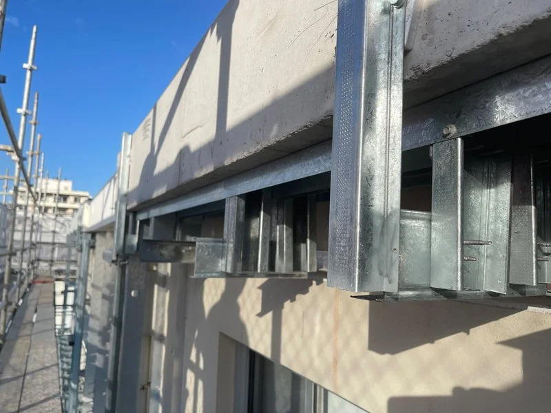 Bracket where new cladding is top be installed