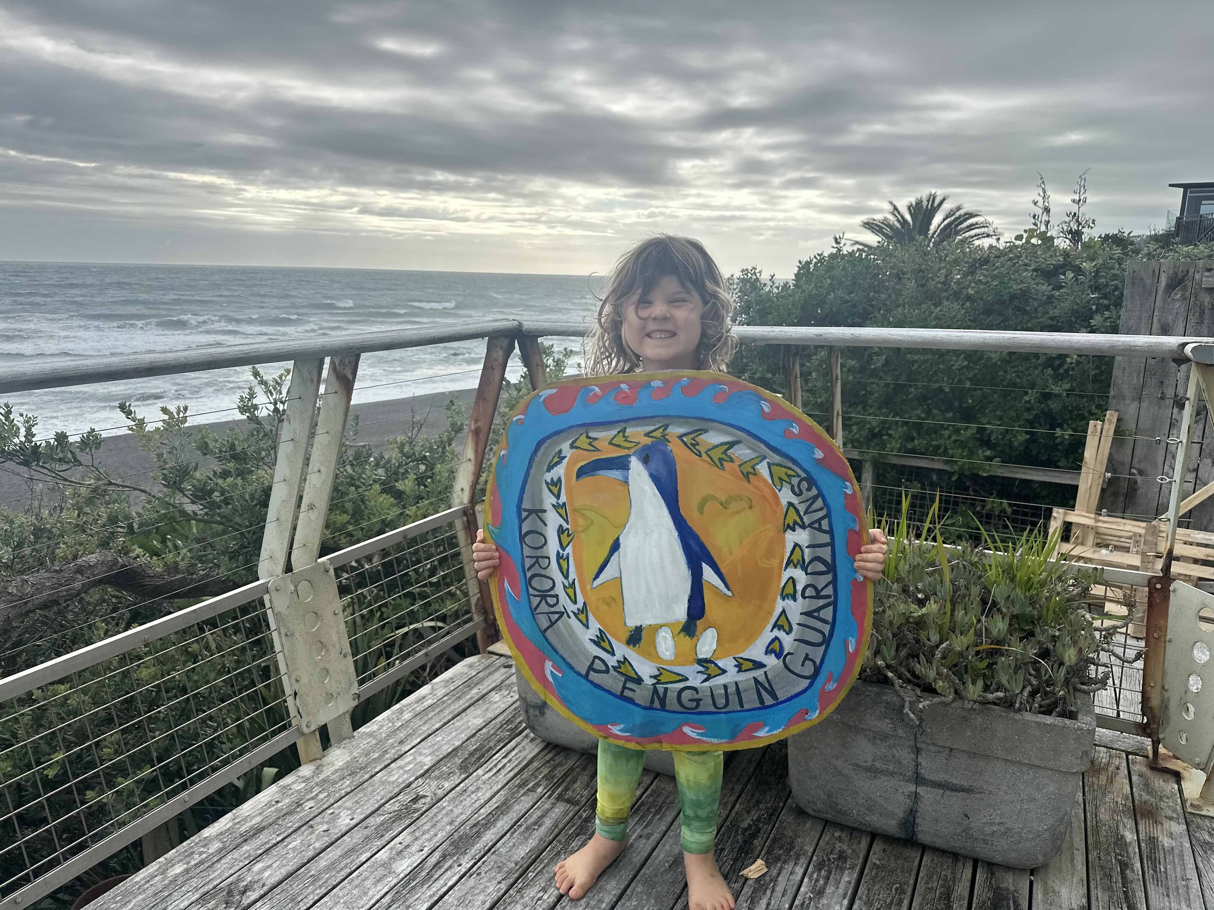 Margaux with penguin sign.jpg