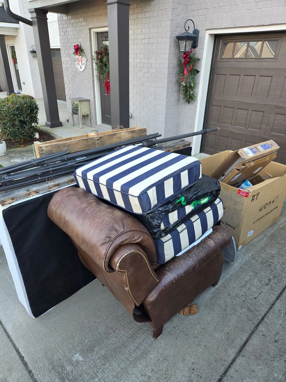 Furniture and moving boxes removed by Lorenz Junk Removal in Murfreesboro