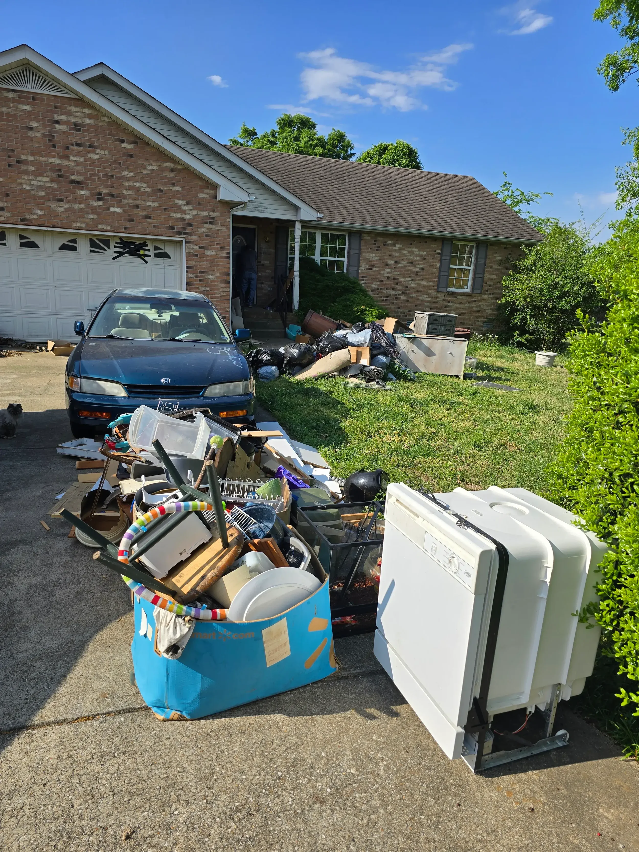 Property cleanout service in Murfreesboro TN removing unwanted furniture and junk from a residential property