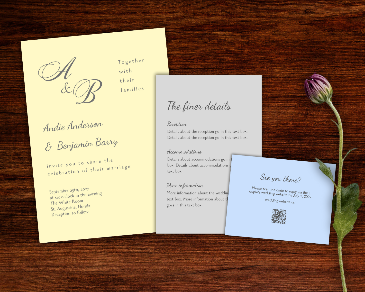 Wedding invitation set with RSVP card, details card, and main invitation card placed on a wooden surface next to a bouquet of blue and white hydrangeas.