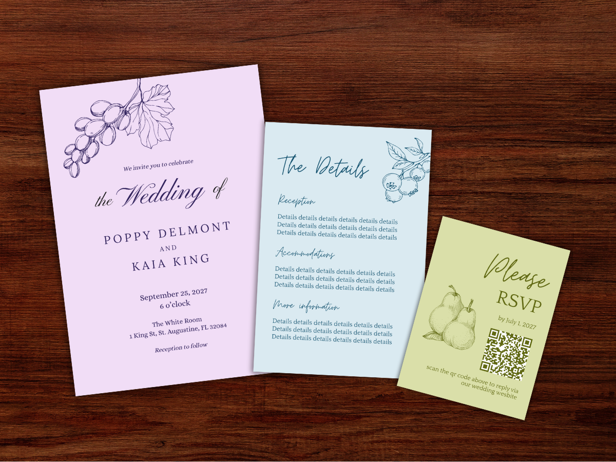 Wedding invitation suite with a main invitation card, RSVP card, and details card, all featuring black text and floral line art, placed on a dark wood surface with three white flowers nearby.
