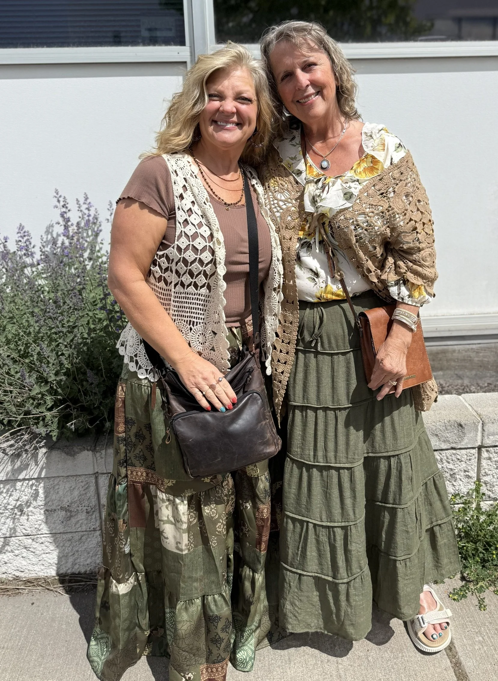 two women standing together in spring clothing
