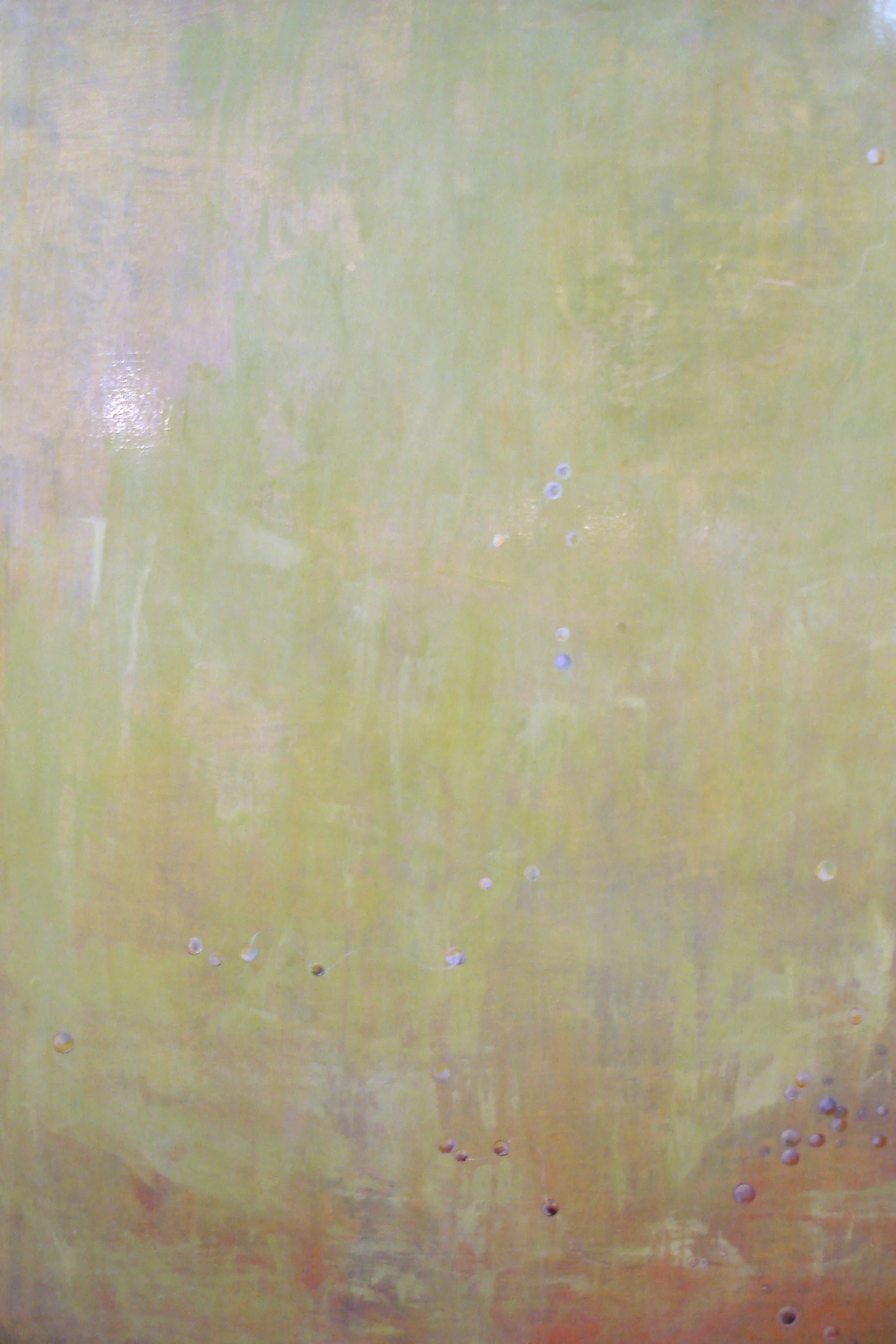 Close-up of a copper surface with small drilled holes and a patina finish.