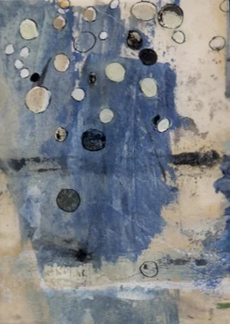 Abstract watercolor painting with various circles and blotches in shades of blue, black, and gray.