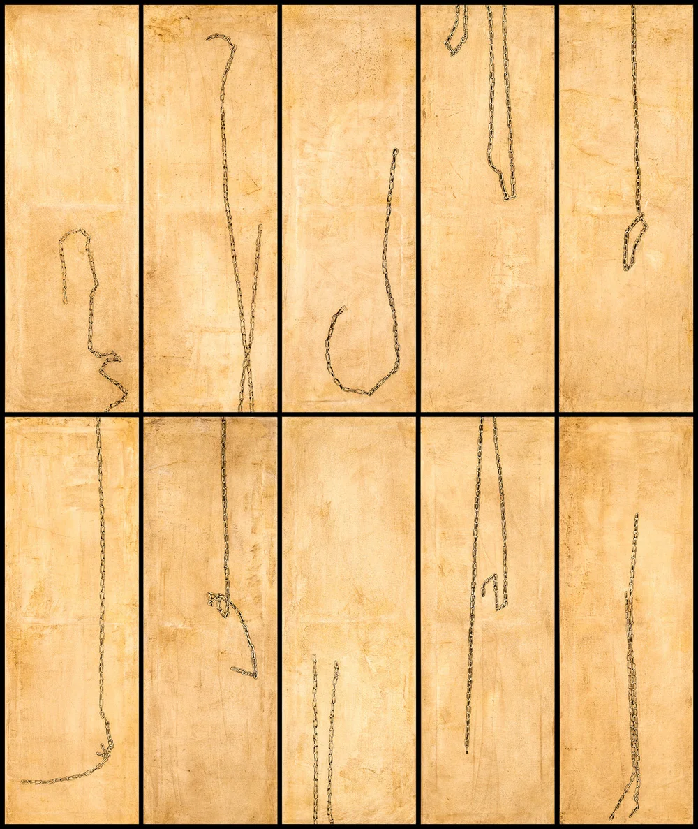Dismantled chains arranged on wooden panels.