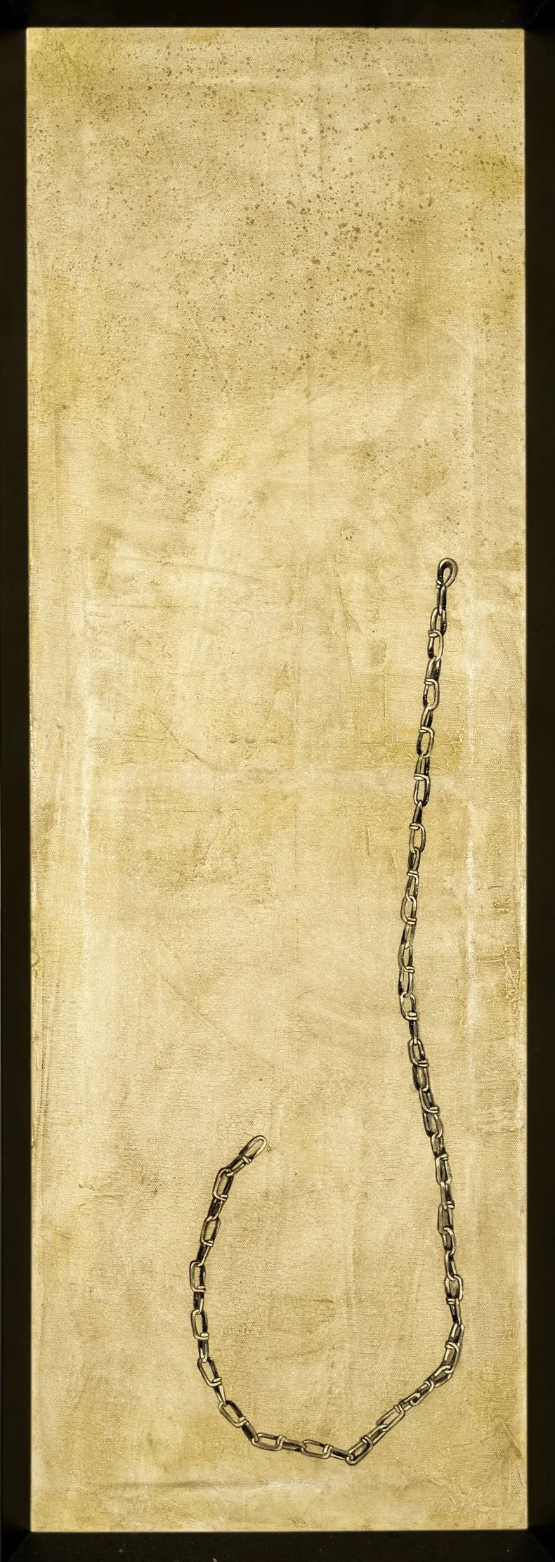 A chain hangs from the middle right side of a beige, textured surface with a black border, possibly a door or wall.