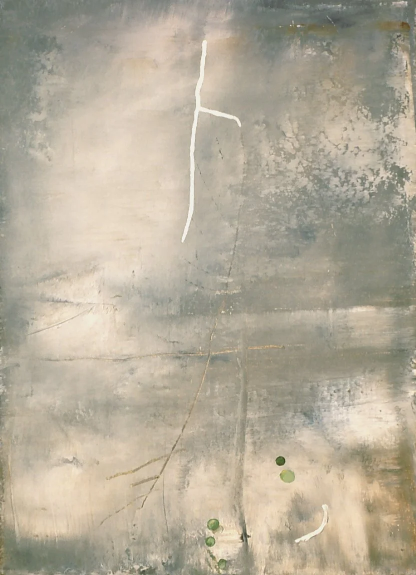 Gray textured wall with white graffiti stick figure and five small green dots near the bottom right.