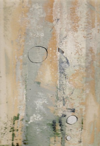 A worn, weathered wall with peeling paint in beige, gray, and green tones, featuring four circular marks.