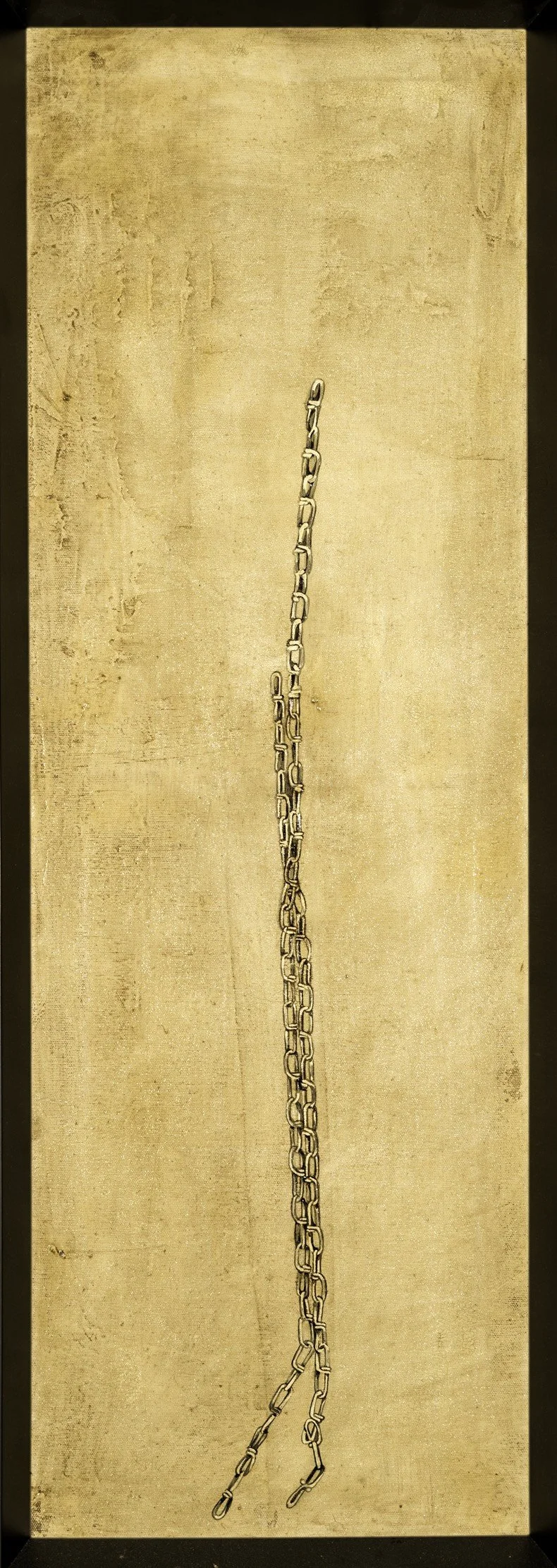 A long, thin, metal chain hanging vertically in the center of the photo against a beige background.