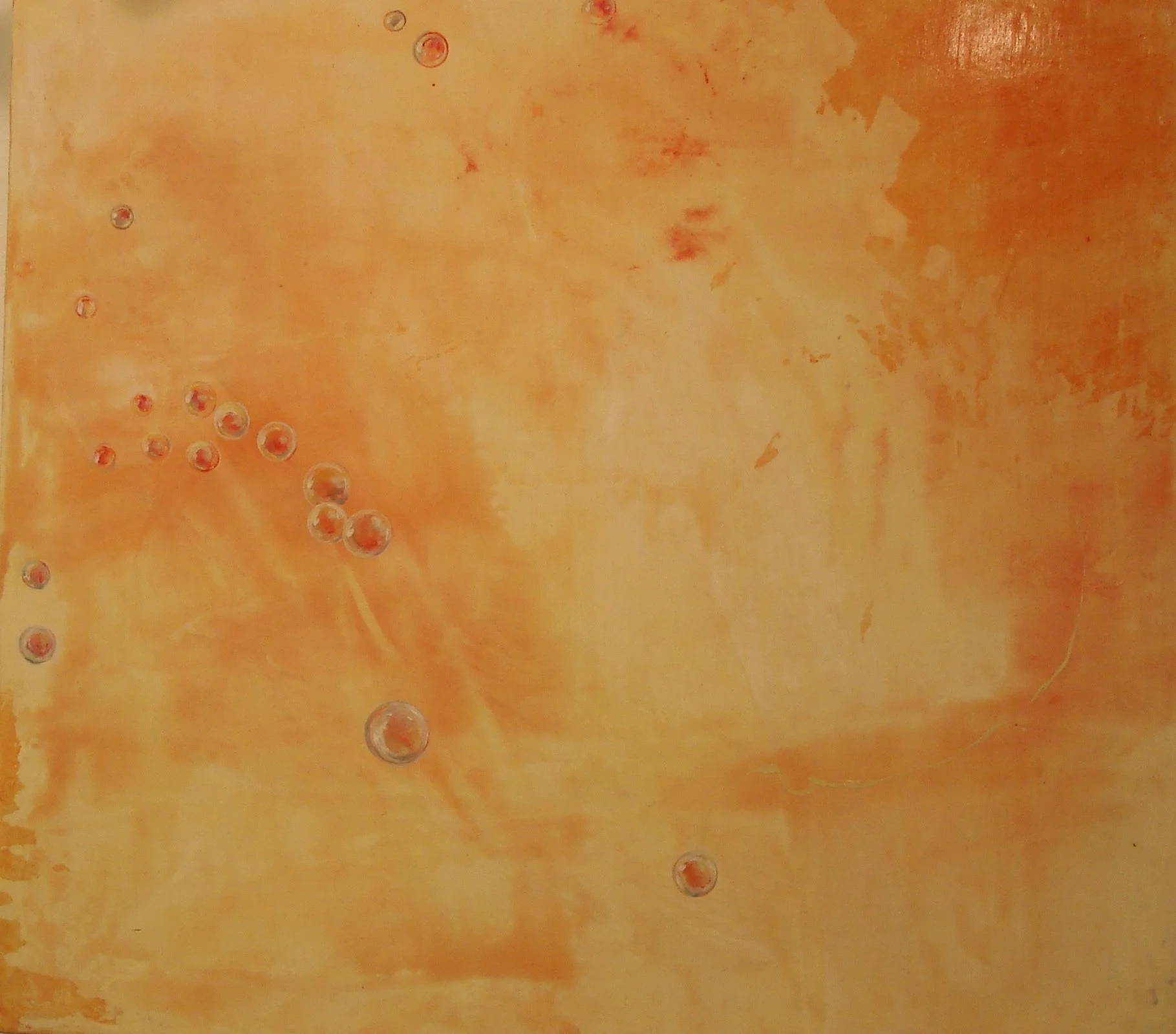 Abstract orange background with scattered transparent bubbles.