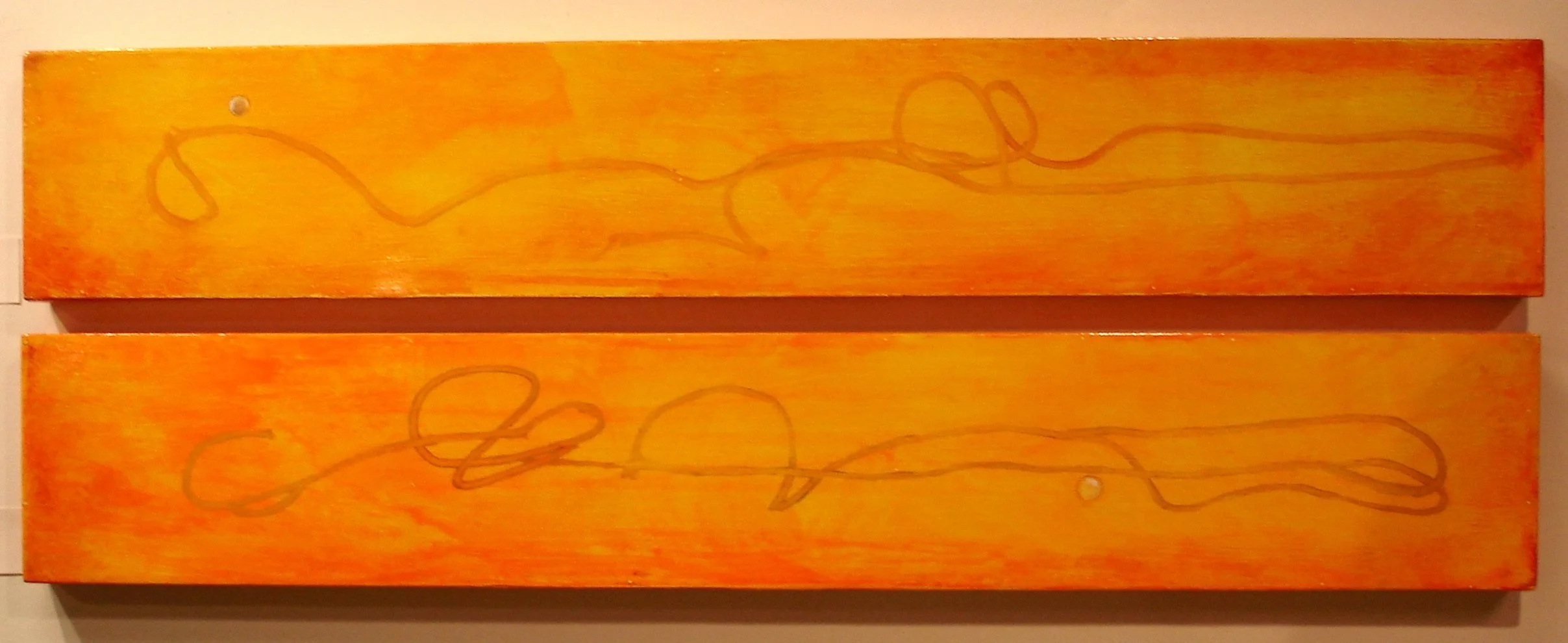 Two horizontal wooden panels painted in shades of orange and yellow, with abstract, continuous line art drawings in brown on both panels.