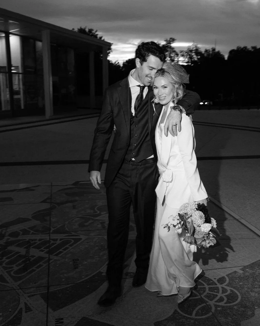 Modern wedding photography at The Marion Canberra — a stylish couple share a quiet, candid moment outside the venue at sunset.