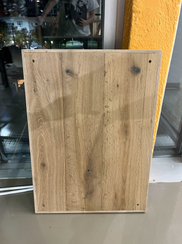 Finished table, with corner holes cut for hanging and installation.