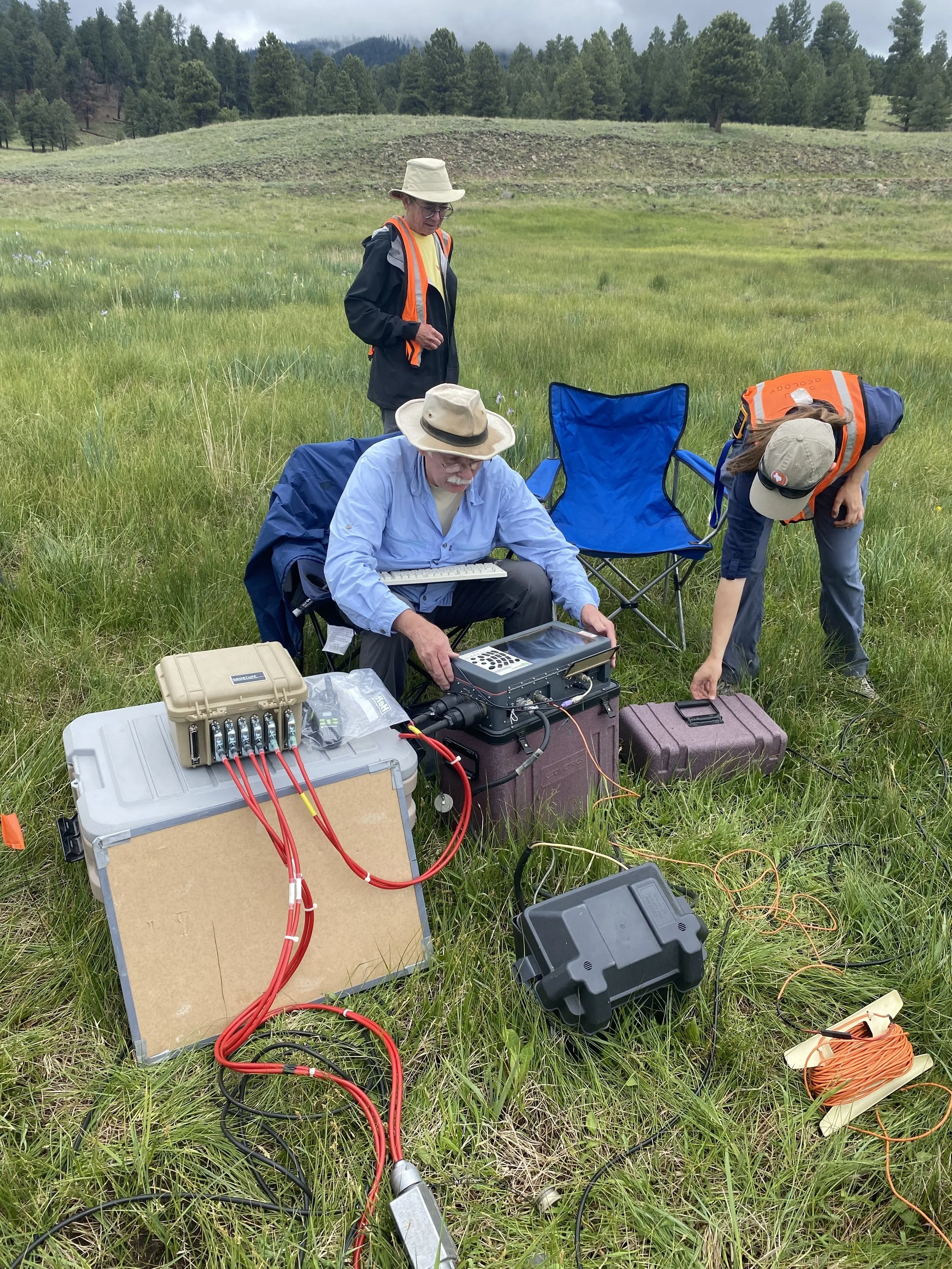 SAGE, Summer of Applied Geophysical Experience. Scientists conducting experiments with electronic equipment.
