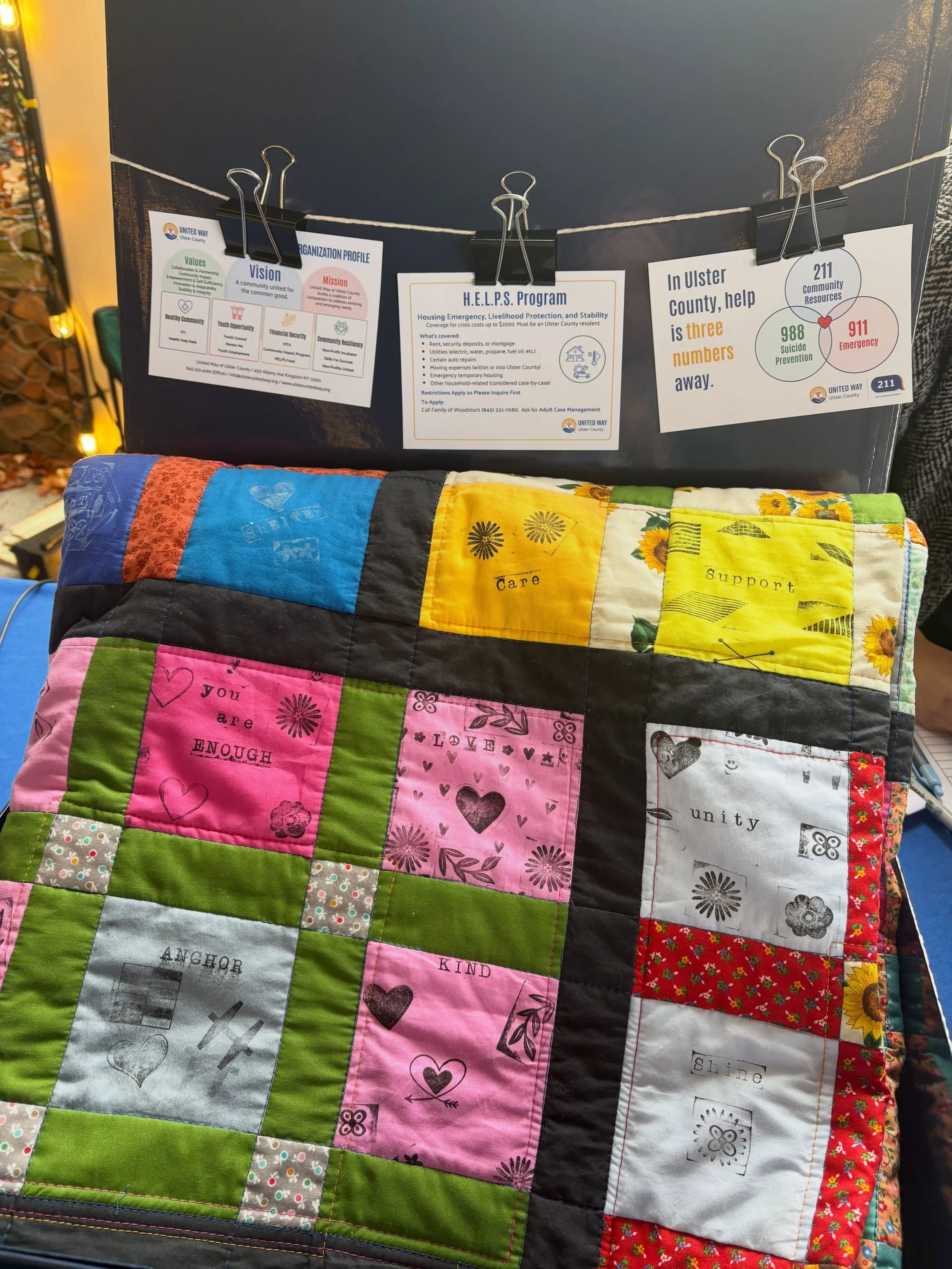 Our beautiful community quilt is on display one last time before it finds its forever home! Place your bid by 6 PM today to bring home this special piece of community history and help support our neighbors in need. Every bid helps turn our community&