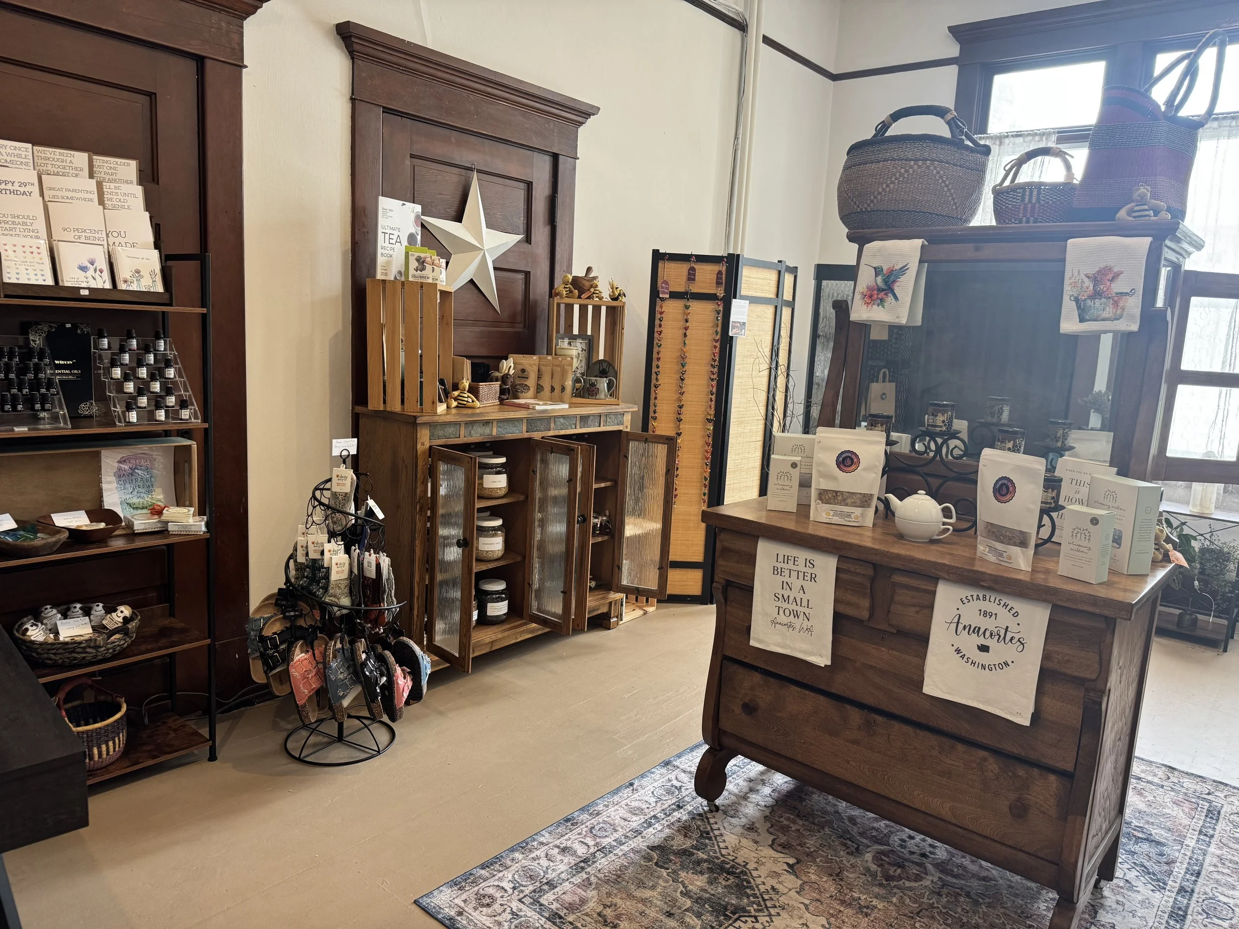 Interior of T's Tallow and Teas showing baskets, tea, essential oils, jewelry and home decor.
