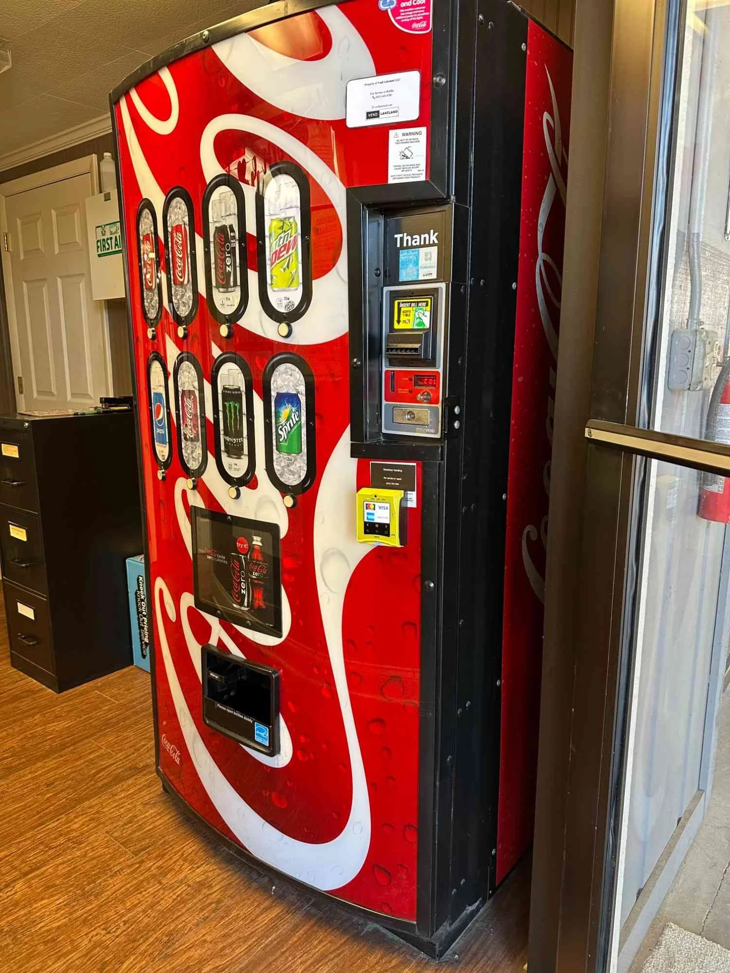 A full snack/drink machine installed at a commercial property.