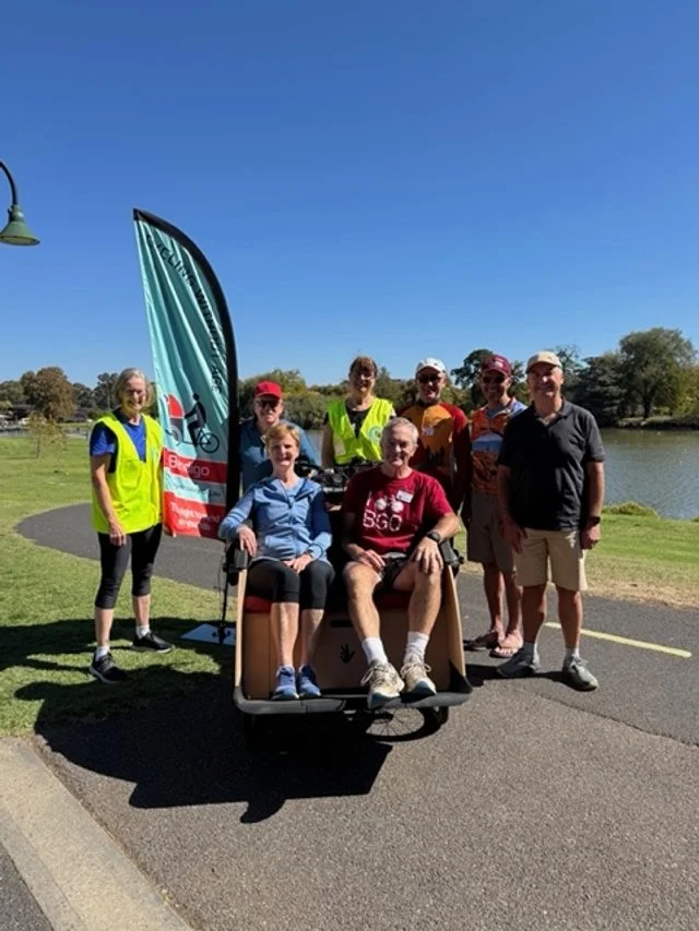 A project from CWA, Cycling Without Age, their team photo. The group wished to begin a club which uses an electric and human powered tricycle to escort elderly people and people with a disability (who have mobility issues) out into local gardens to e