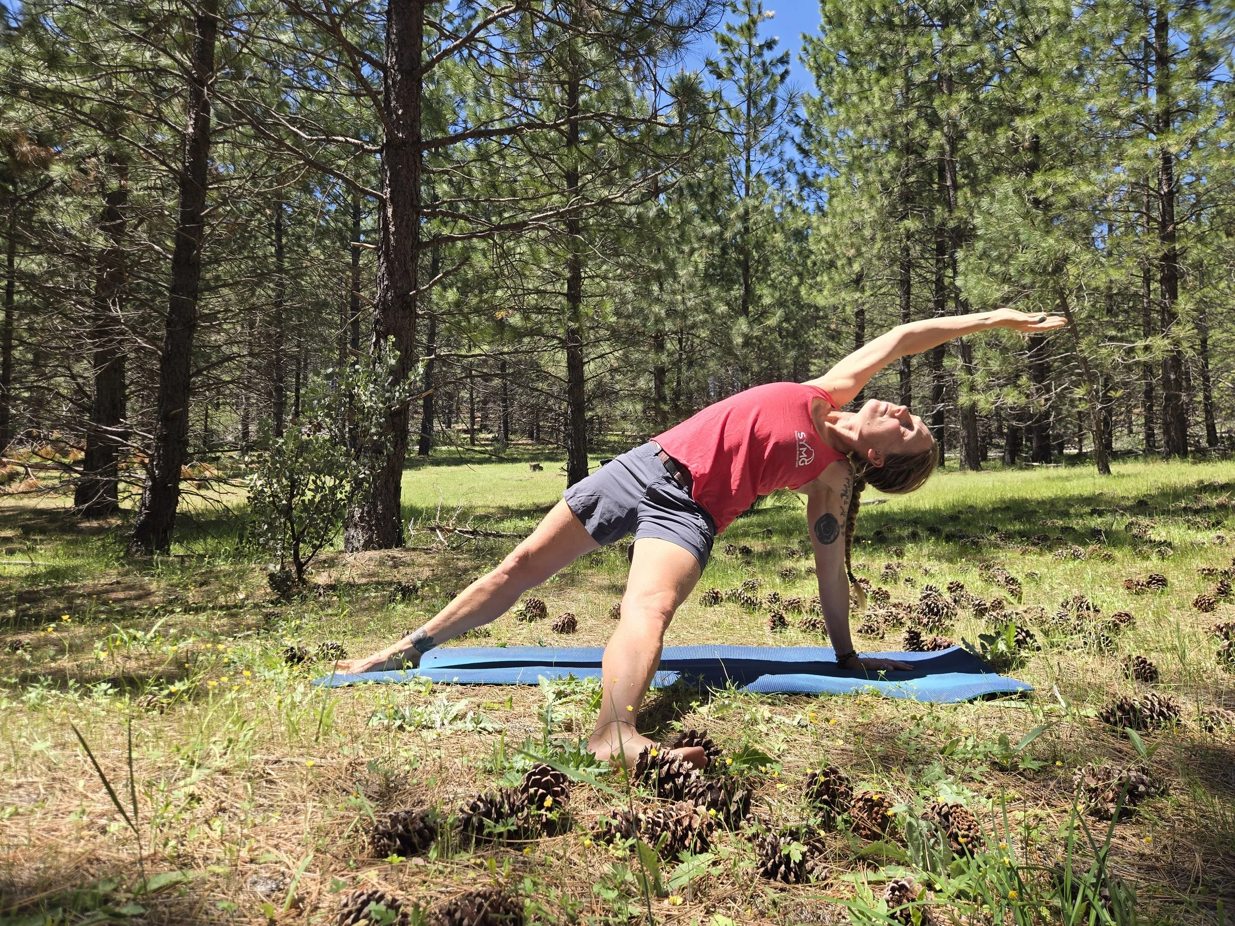 Michelle practicing yoga doing the fallen triagle
