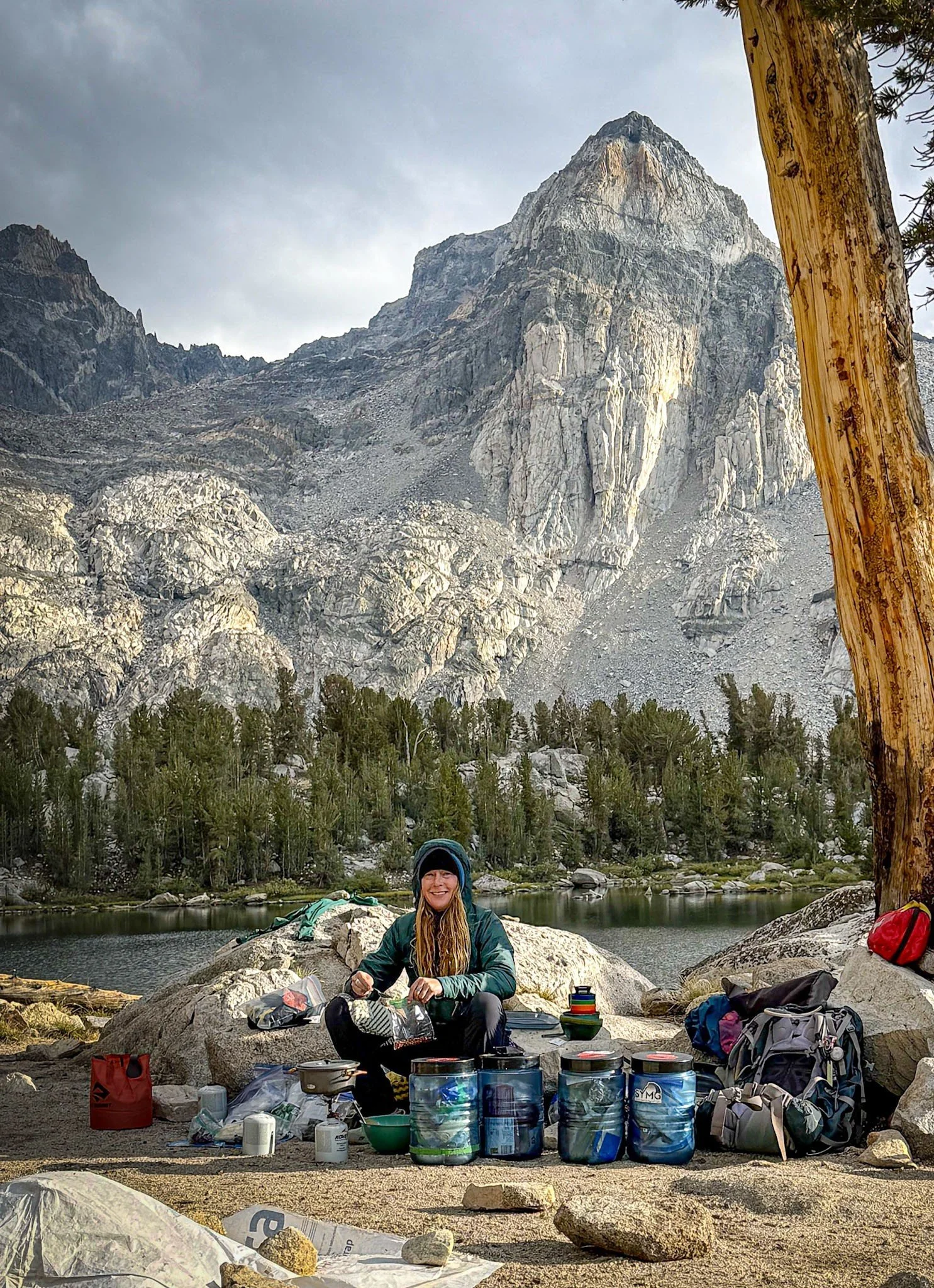 Axis Wild Expeditions guide preparing a fresh backcountry dinner in the Sierra Nevada