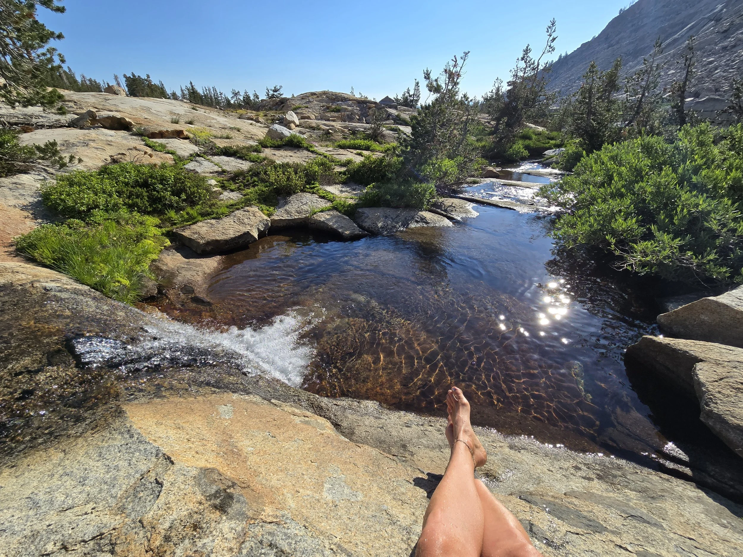 Lady lake crossed legs stream.jpg