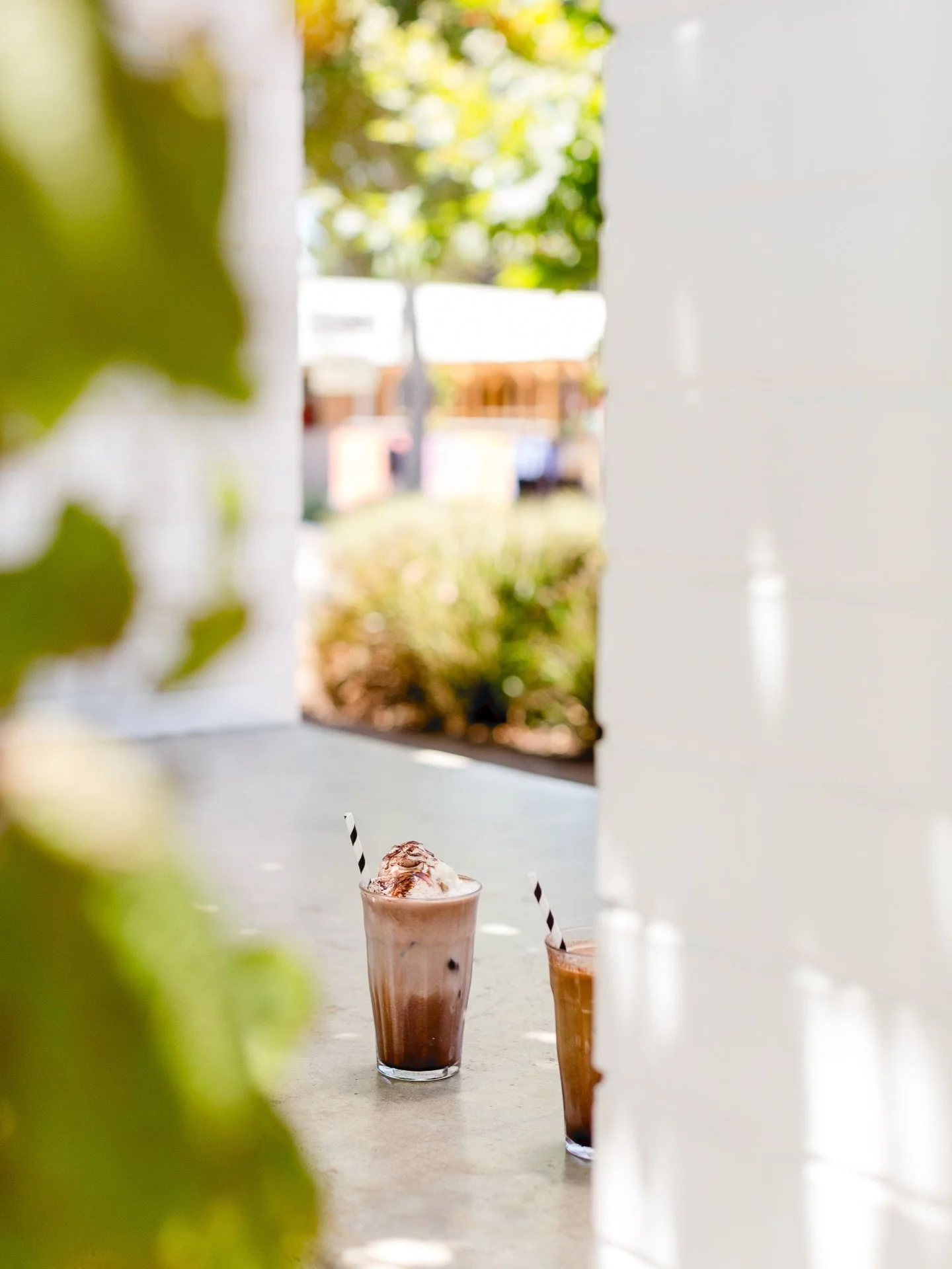 Iced latte or iced chocolate? Everything tastes better in the sunshine ~ ☀️

Come &amp; enjoy the sun on our outdoor terrace.🌱
