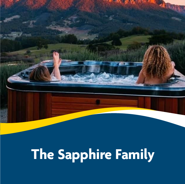 People relaxing in a hot tub with mountain view