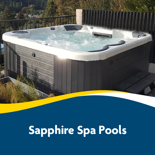 Outdoor hot tub on a deck with bubbling water, surrounded by greenery. Text overlay reads 'Sapphire Spa Pools.'