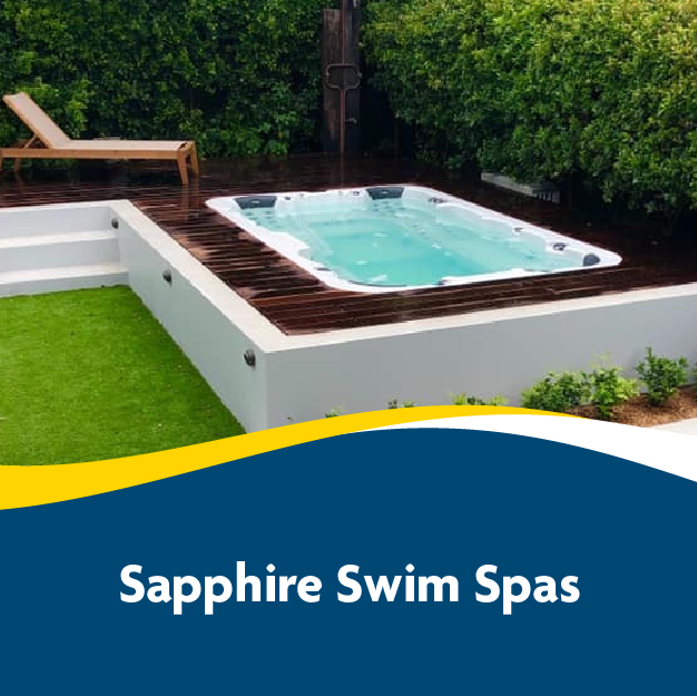 Outdoor swim spa with wooden deck and lounge chair from Sapphire Swim Spas.