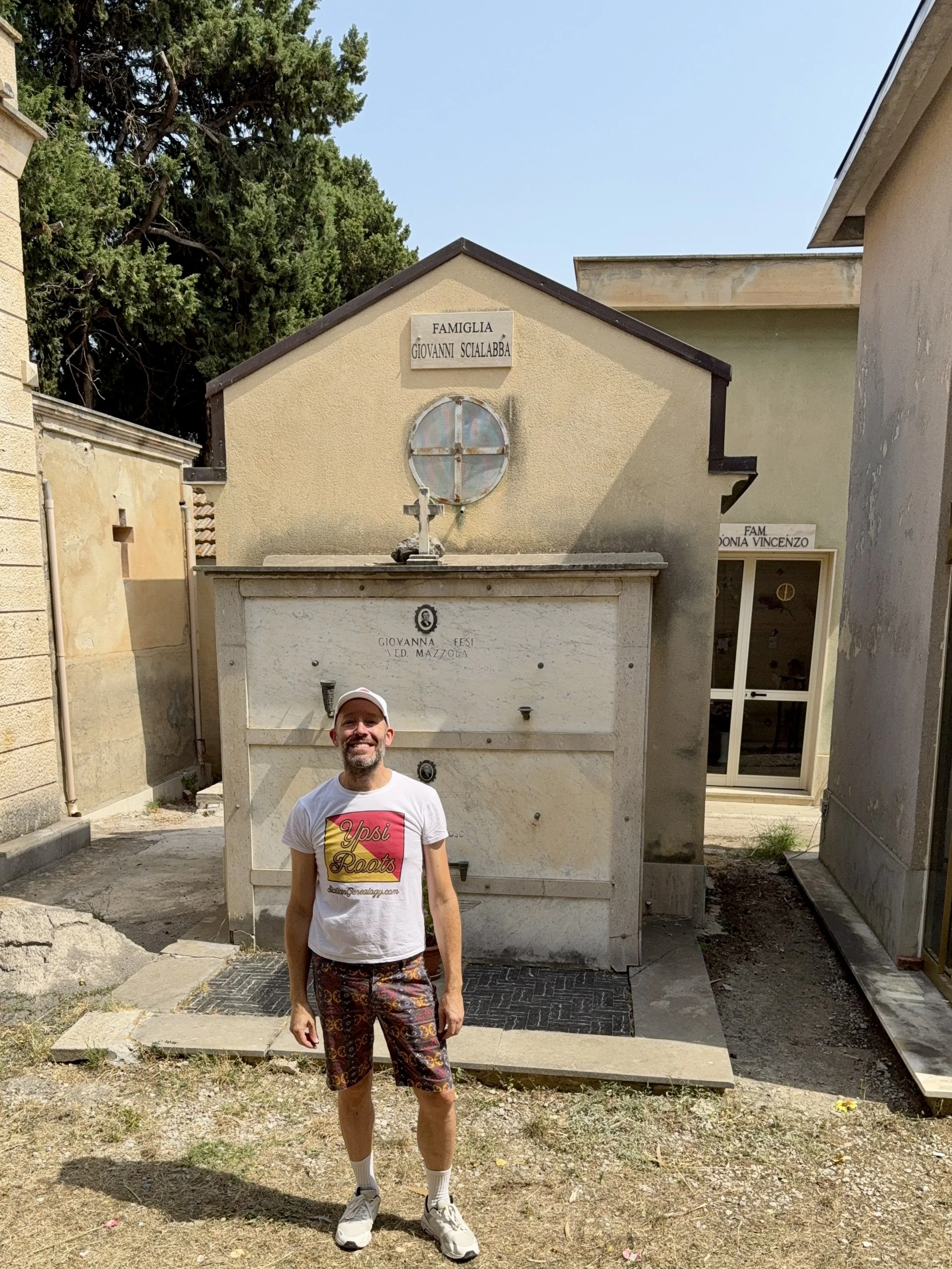 YpsiRoots Founder Daniel Tills standing in the cemetery in Castelbuono Sicily