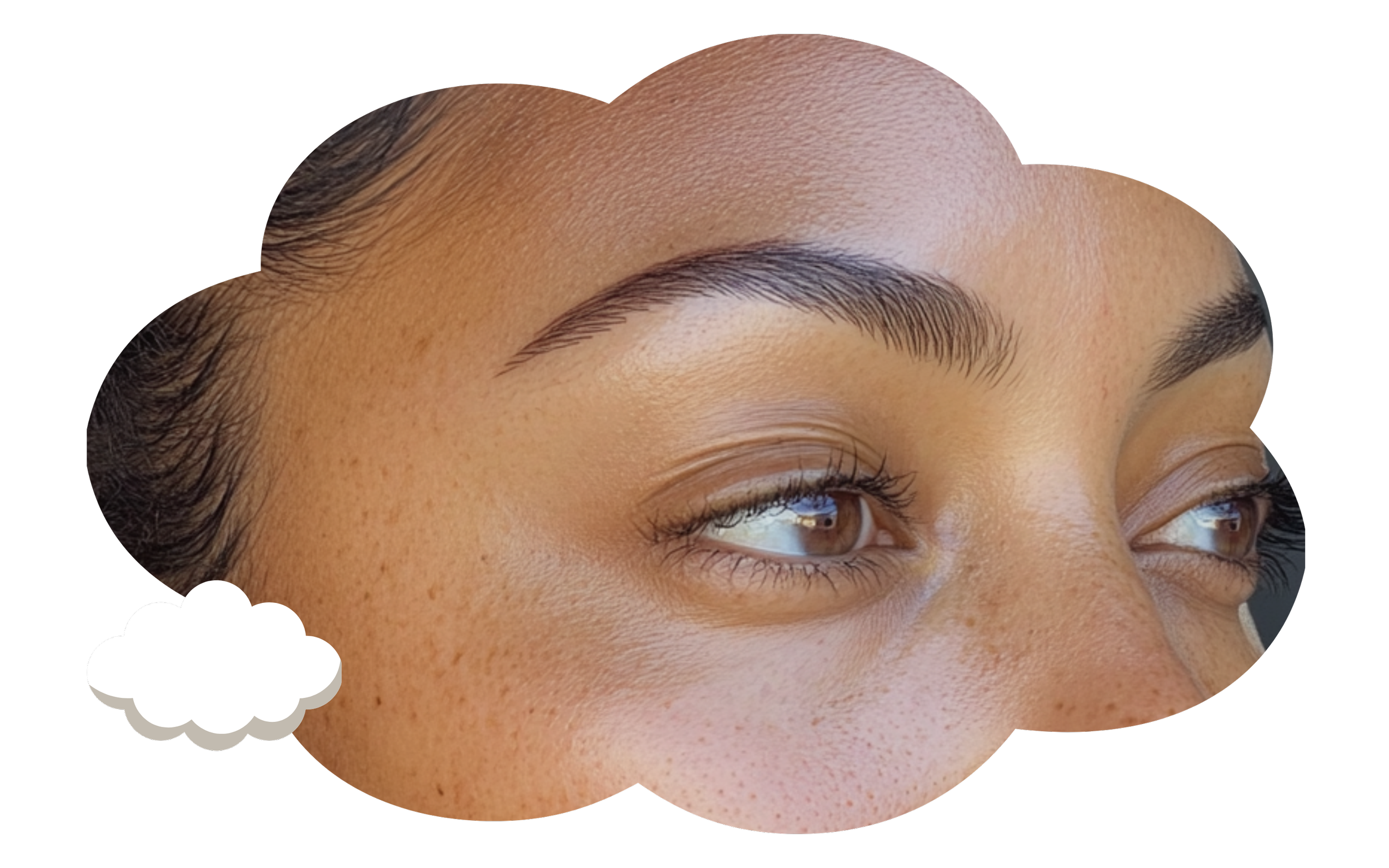 Close-up of a person's face focusing on brown eyes, eyebrows, and skin texture with minimal makeup.