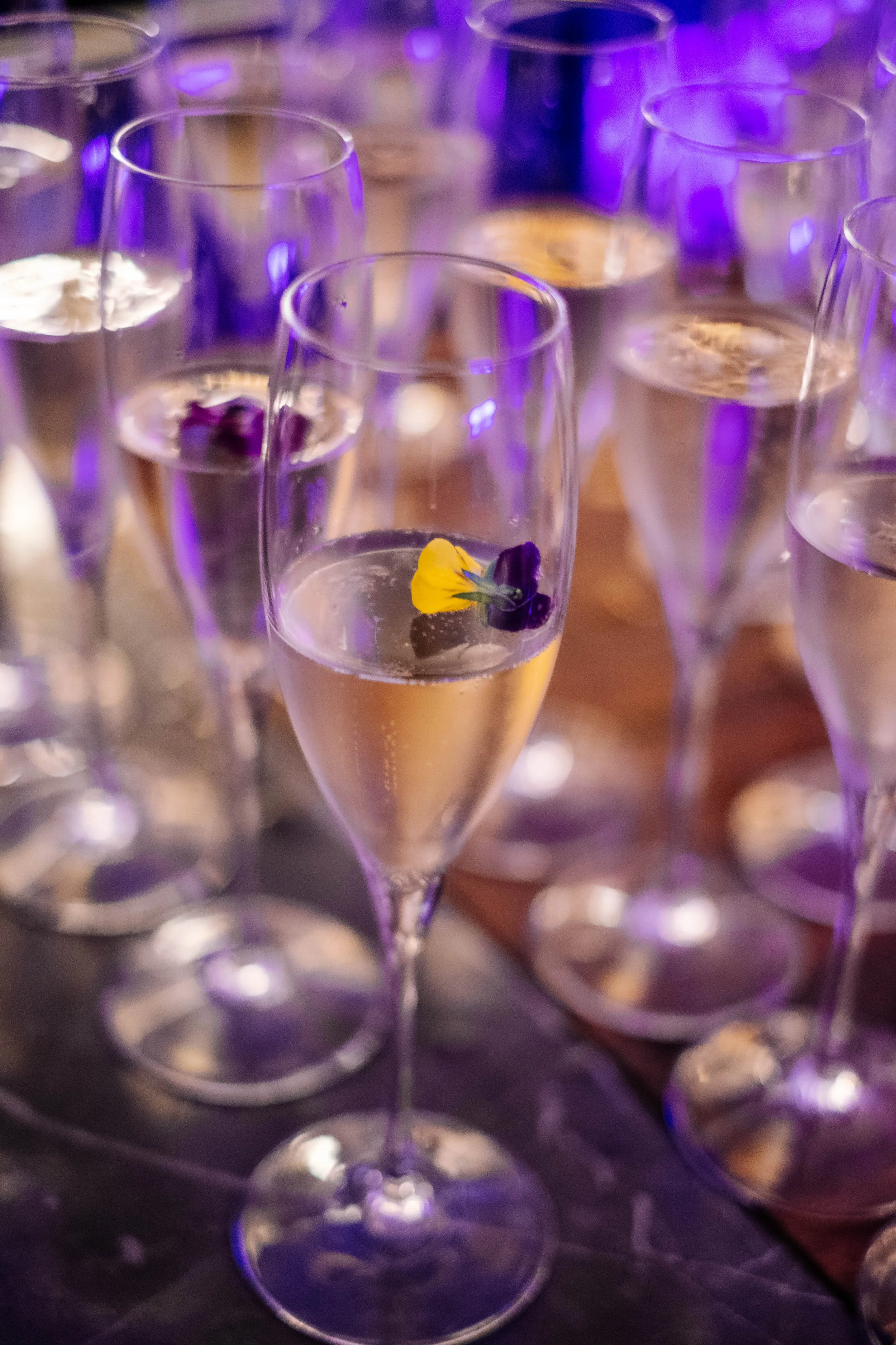 Champagne glasses with floral garnish at the Standard Bank Taste Tomorrow Series