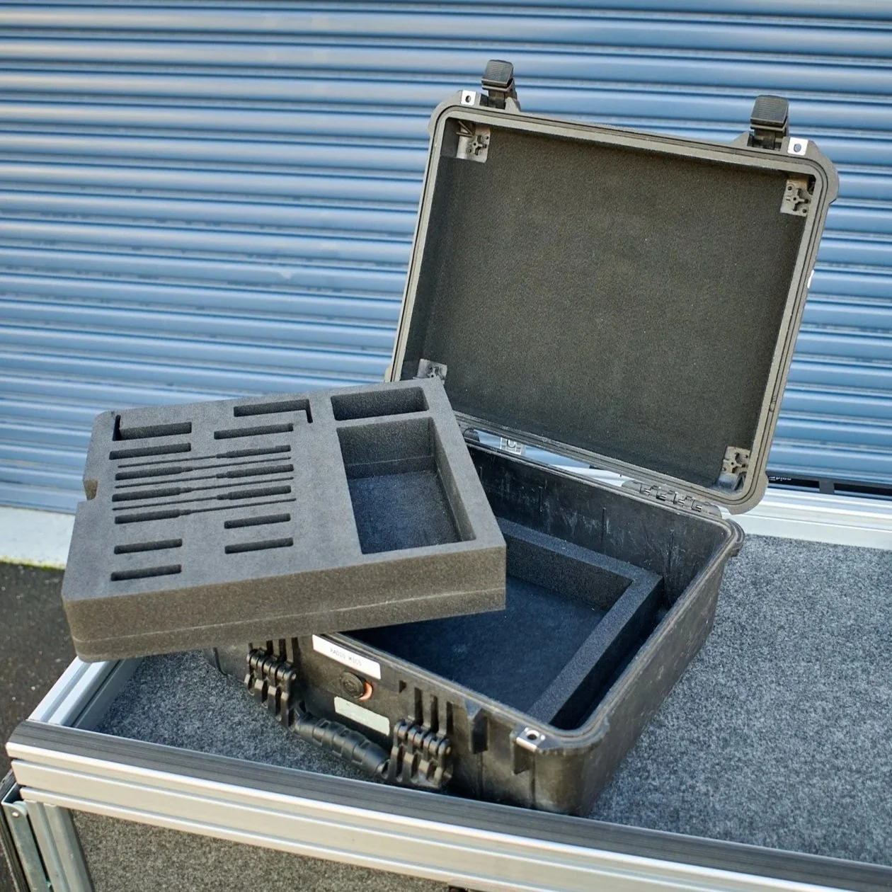 Multi-layer radio mic insert for a Pelican 1550