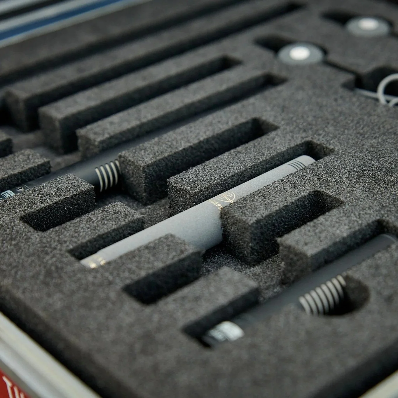 Multi-layer shotgun mic insert for a Pelican 1550