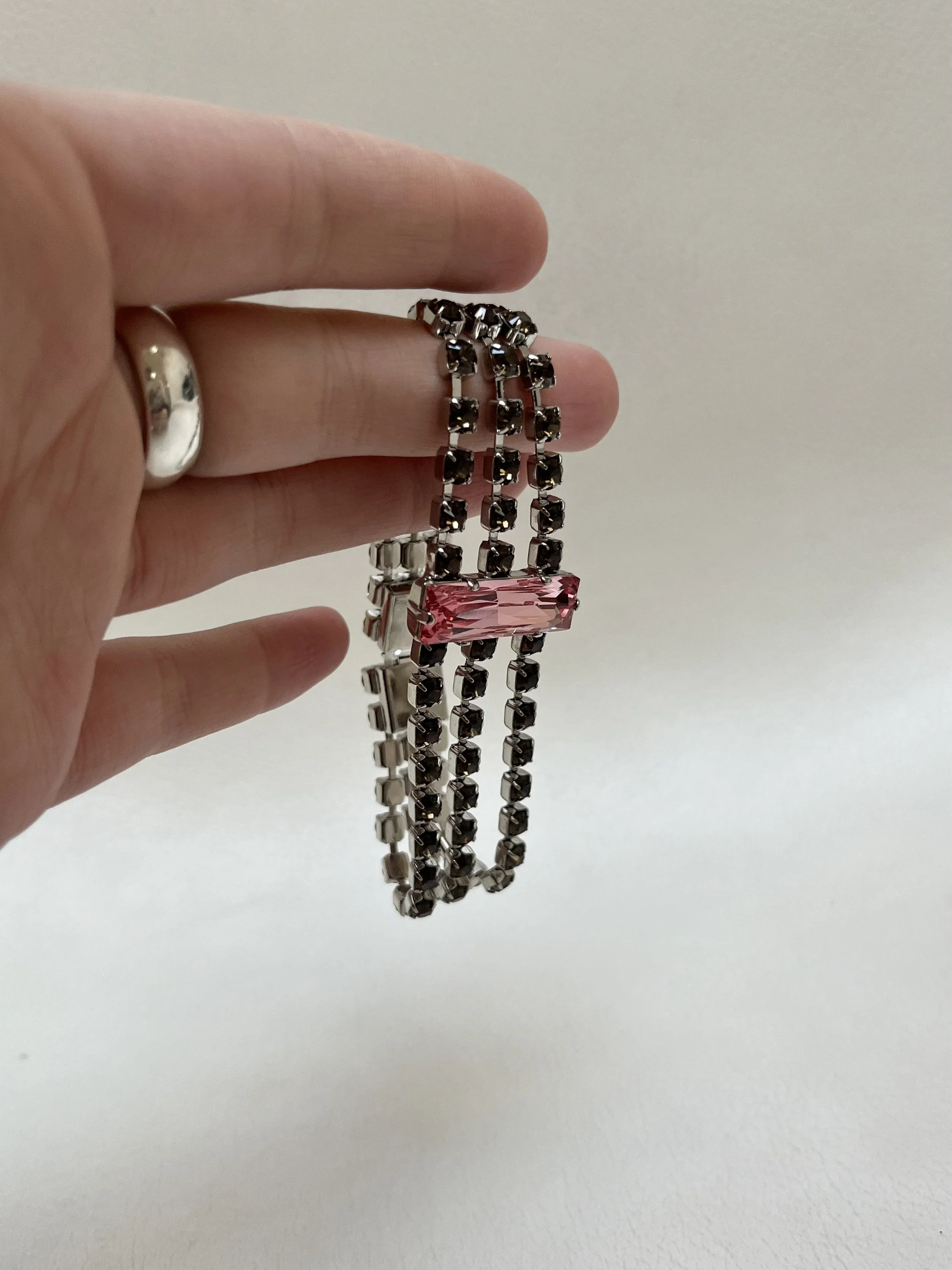 Multi-row rhinestone bracelet with pink stone