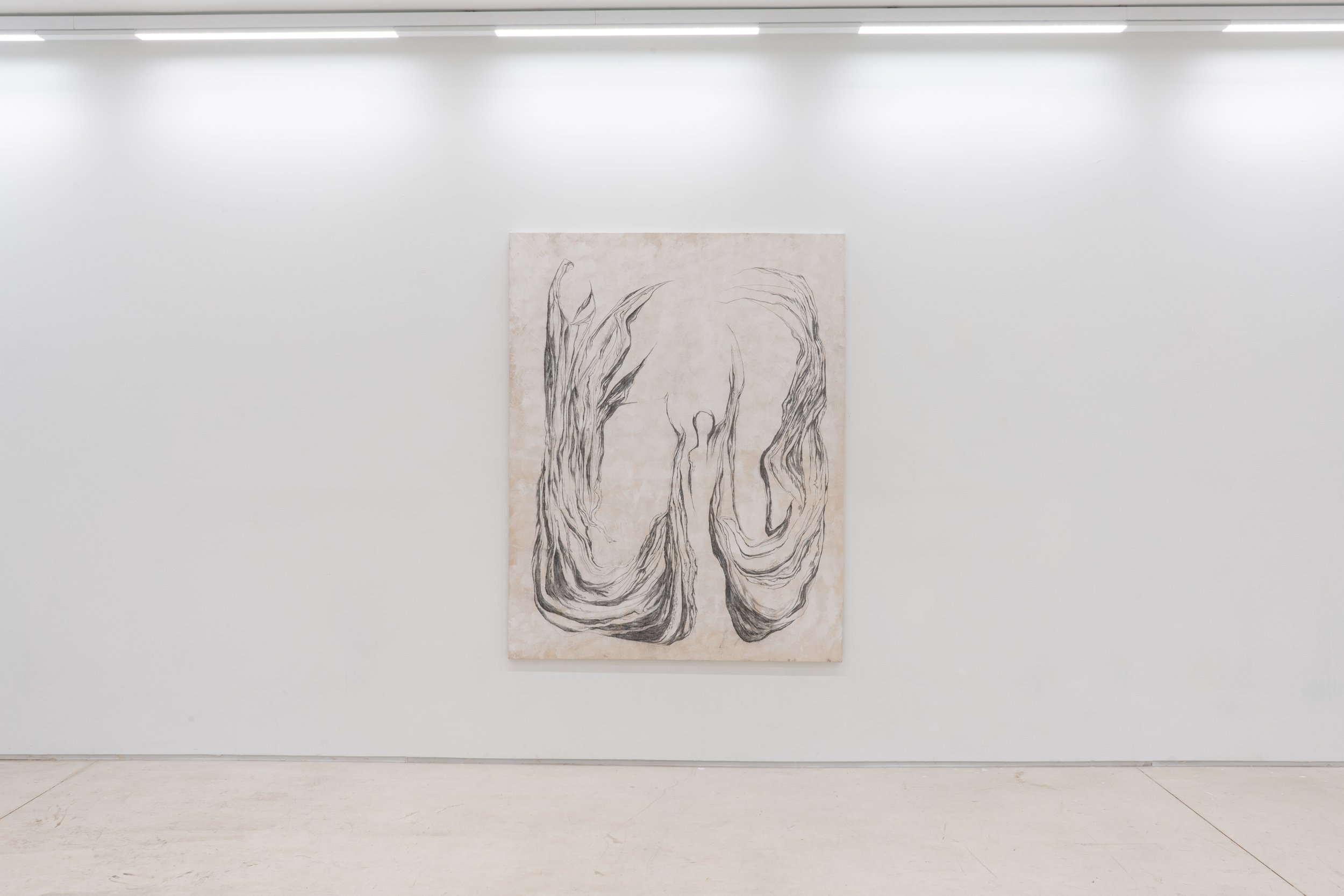 Art gallery with white walls and ceiling lights, featuring a large vertical artwork with black, abstract line drawings on light-colored background.